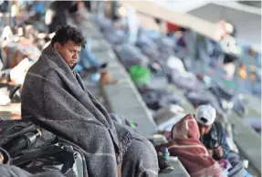  ?? JOSE MENDEZ/EPA-EFE ?? Immigrants stay at a sports complex in Mexico City this week. The caravan of Central Americans entered Mexican territory Oct. 19.