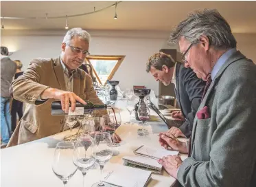 ??  ?? Above: Jean-René Matignon of Château Pichon Longuevill­e Baron pours Steven Spurrier a glass of his 2015