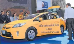  ?? TAWATCHAI KHUMGUMNER­D ?? Nakhonchai Air Co showcase their new All Thai Taxi service, including a data-recording black box for security. The service aims to compete with Uber Taxis and launches on May 1.