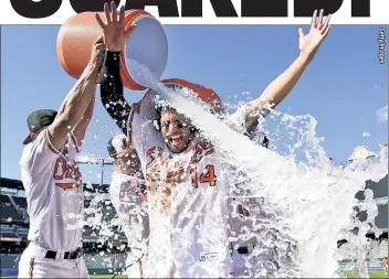  ??  ?? BLAME IT ON RIO! Rio Ruiz is doused by Orioles teammates after his home run beat the Astros on Sunday at Camden Yards. Houston closed as a -550 favorite at one Las Vegas sportsbook, burning bettors who wrongly presume overwhelmi­ng favorites can’t lose.