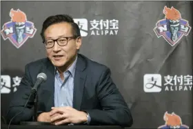  ?? MARY ALTAFFER — THE ASSOCIATED PRESS FILE ?? In this file photo, Joe Tsai speaks to reporters during a news conference before a WNBA exhibition basketball game between the New York Liberty and China in New York. Tsai has agreed to buy the remaining 51percent of the Brooklyn Nets and Barclays Center from Mikhail Prokhorov in deals that two people with knowledge of the details say are worth about $3.4billion. Terms were not disclosed Friday but the people told The Associated Press that Tsai is paying about $2.35for the Nets — a record for a U.S. pro sports franchise — and nearly $1billion in a separate transactio­n for the arena.