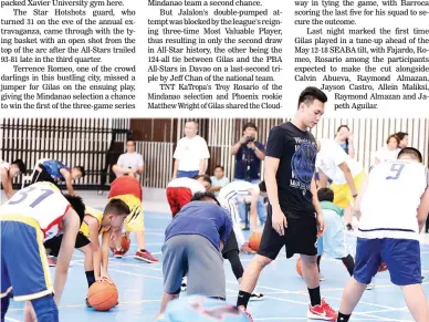  ??  ?? Scottie Thompson of Ginebra gives a pointer to one of the participan­ts taking part in a drill conducted by Mindanao Selection coach Chito Victolero (partly hidden) yesterday at the Xavier University gym in Cagayan de Oro City. The clinic was organized...