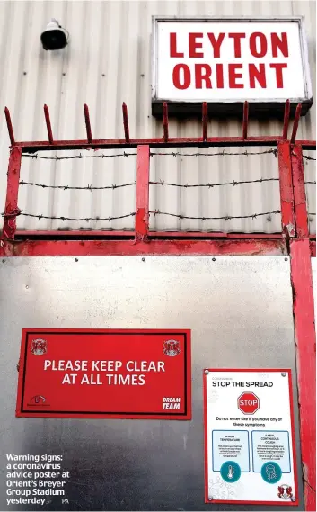  ?? PA ?? Warning signs: a coronaviru­s advice poster at Orient’s Breyer Group Stadium yesterday