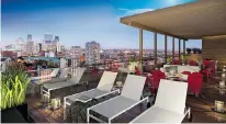  ??  ?? An indoor/outdoor rooftop lounge affords great cityscape views.