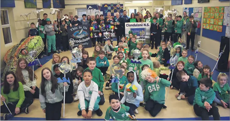  ?? (Photo: Katie Glavin) ?? Clondulane NS, Clondulane community and Fermoy Street Arts celebratin­g at the local school as members of the Fermoy St Patrick’s Day parade committee presented them with the trophy for the ‘Best Overall’ entry.
