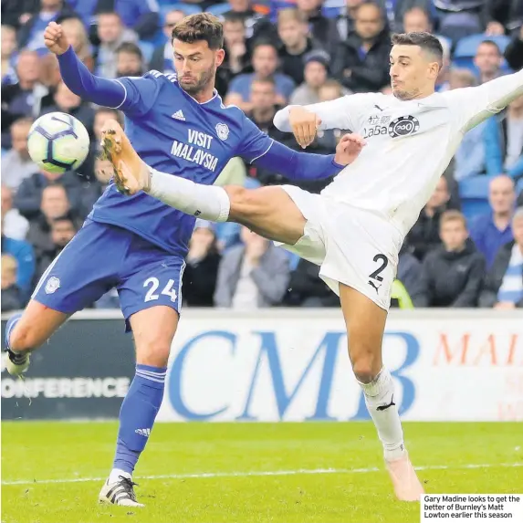  ??  ?? Gary Madine looks to get the better of Burnley’s Matt Lowton earlier this season