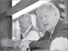  ??  ?? LONDON
Britain's Prime Minister Boris Johnson speaks during his visit to a farm in Wrexham, Wales, Britain. -REUTERS