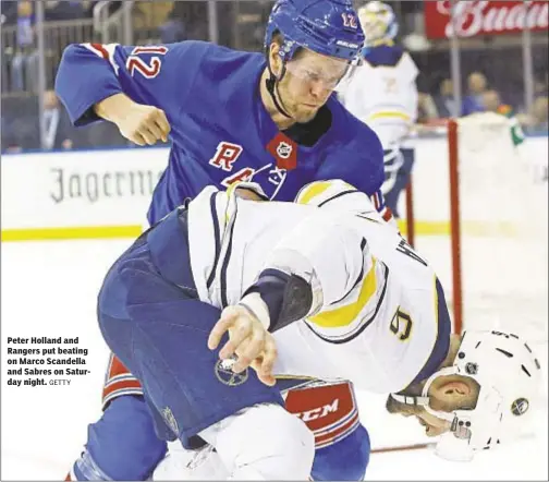  ?? GETTY ?? Peter Holland and Rangers put beating on Marco Scandella and Sabres on Saturday night.