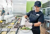  ??  ?? Sonia Florez prepares a salad at the Coolgreens at Will Rogers World Airport.