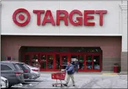  ?? CHARLES KRUPA — THE ASSOCIATED PRESS ?? A Target store on Monday in Salem, N.H. Target reported on Tuesday a 43% drop in profits and a slight uptick in sales for the holiday quarter.