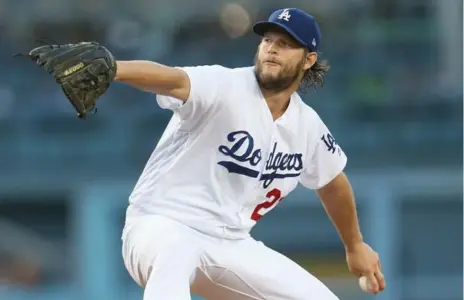  ?? STEPHEN DUNN/GETTY IMAGES ?? In a sign of the times in baseball, the Dodgers’ Clayton Kershaw threw a complete game with 13 strikeouts on Sunday while throwing only 99 pitches.
