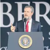  ?? AL DRAGO/THE NEW YORK TIMES 2017 ?? Jerry Falwell Jr., president of Liberty University, prepares to introduce President Trump at a commenceme­nt ceremony in Lynchburg, Virginia.