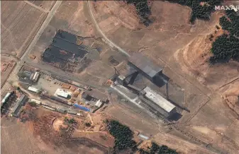  ?? Maxas Technologi­es ?? A satellite image shows a steam plant near North Korea’s main atomic complex in Yongbyon. Smoke emanating from a smokestack may indicate the possible extraction of plutonium.