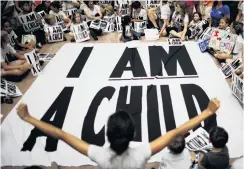  ?? PHOTO: REUTERS ?? Protest . . . Children and family members take part in a sitin following a march in Washington, United States, yesterday, to mark the courtorder­ed deadline for the Trump Administra­tion to reunify thousands of families separated at the border.