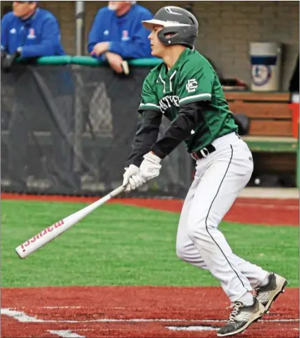  ?? RANDY MEYERS — THE MORNING JOURNAL ?? Elyria Catholic’s Leighton Banjoff delivers a hit to right field against Bay. Banjoff’s double brought home the winning run.