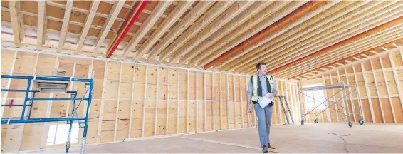  ?? PHOTOS: DARREN STONE, TIMES COLONIST ?? Greater Victoria School District secretary-treasurer Mark Walsh shows inside and outside a learning studio being built for Central Middle School.