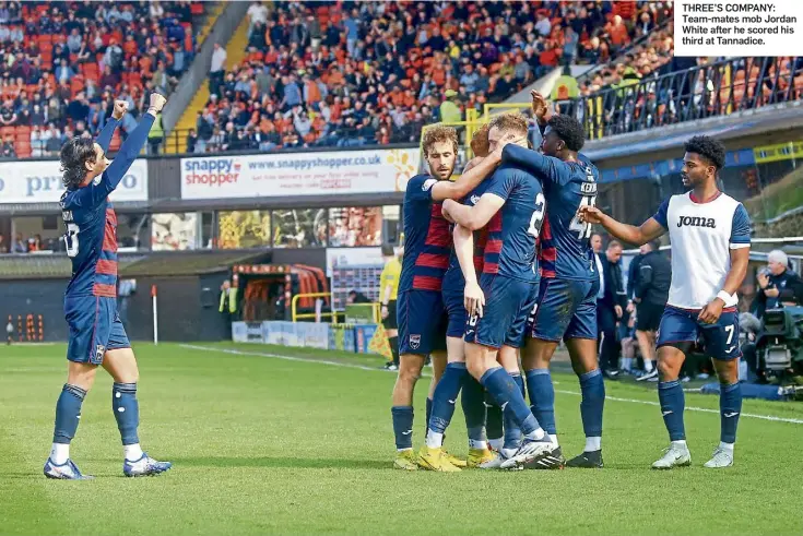  ?? ?? THREE’S COMPANY: Team-mates mob Jordan White after he scored his third at Tannadice.