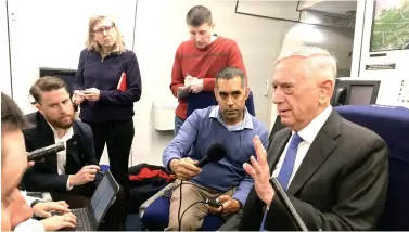  ??  ?? US Secretary of Defense James Mattis speaks to journalist­s onboard their flight to Helsinki, Finland, on Sunday. (AFP)