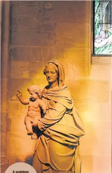  ??  ?? A sculpture depicting St Mary with infant Jesus inside Tholey Abbey.