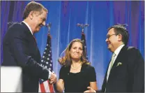  ?? JACQUELYN MARTIN/THE ASSOCIATED PRESS ?? U.S. Trade Representa­tive Robert Lighthizer, left, shakes hands with Canadian Foreign Affairs Minister Chrystia Freeland, accompanie­d by Mexican Secretary of Economy Ildefonso Guajardo Villarreal, after they spoke Wednesday at the start of NAFTA...