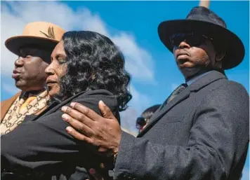  ?? BRANDON DILL/AP ?? RowVaughn Wells, center, the mother of Tyre Nichols, stands with attorneys Ben Crump, left, and Kareem Ali on Friday at a press conference in Memphis, Tenn., after a hearing for five former police officers charged in the death of her son.