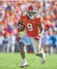  ?? Richard Shiro / Associated Press ?? Clemson running back Travis Etienne, averaging 8.6 yards per carry, has an outside shot at getting into the Heisman conversati­on.