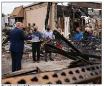  ?? (AP/Evan Vucci) ?? President Donald Trump talks to business owners Tuesday in Kenosha, Wis., in an area that was damaged during demonstrat­ions after a police shooting that injured Jacob Blake. More photos at arkansason­line.com/92presiden­t/.