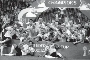  ?? Associated Press ?? German players celebrate after winning the Confederat­ions Cup final soccer match between Chile and Germany on Sunday at the St. Petersburg Stadium in Russia. Germany won, 1-0.