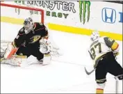  ?? Chris Carlson Associated Press ?? GOLDEN KNIGHTS defenseman Shea Theodore scores the winner past Ducks goalie John Gibson.