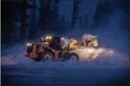  ?? PETER MORNING — MAMMOTH MOUNTAIN SKI AREA VIA AP ?? This photo provided by Mammoth Mountain Ski Area shows crew clearing fresh snow fall at Mammoth Mountain ski area, in Mammoth Lakes Wednesday.