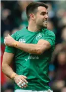  ??  ?? Conor Murray celebrates scoring Ireland’s first try in Murrayfiel­d