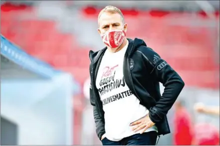  ?? POOL/AFP ?? Bayern Munich coach Hans-Dieter Flick wears a shirt that reads ‘Red against racism – Black Lives Matter’. His team is closing in on a Bundesliga title.