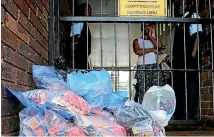  ?? PHOTO: AP ?? A woman waits at a shop near Johannesbu­rg for a refund on processed foods suspected of being contaminat­ed with listeria.