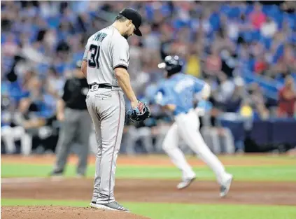  ?? CHRIS O'MEARA/AP ?? Marlins starter Caleb Smith looks away as the Rays’ Michael Brosseau runs the bases after hitting a solo home run in the third inning Sunday.