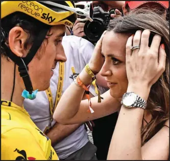  ??  ?? Champion: Briton Geraint Thomas is greeted in Paris by his stunned wife Sara