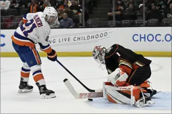  ?? ALEX GALLARDO — THE ASSOCIATED PRESS ?? New York Islanders center Kyle Palmieri scores on Ducks goaltender Lukas Dostal for a 2-0first-period lead on Sunday.
