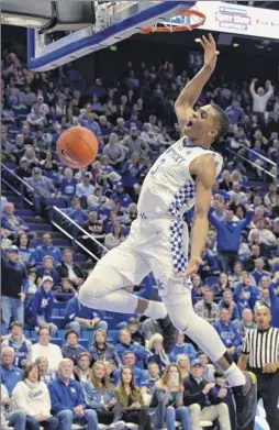  ?? Timothy D. Easley / Associated Press ?? Kentucky guard Keldon Johnson (3) dunks during the second half against Southern Illinois on Friday. Johnson scored 15 points.