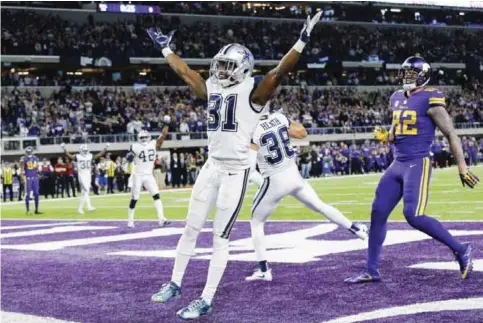  ?? — AP ?? MINNEAPOLI­S: Dallas Cowboys free safety Byron Jones (31) celebrates in front of Minnesota Vikings tight end Kyle Rudolph, right, after breaking up a pass in the end zone during the second half of an NFL football game Thursday, in Minneapoli­s. The...