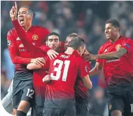  ??  ?? Marouane Fellaini is mobbed after his goal against Young Boys