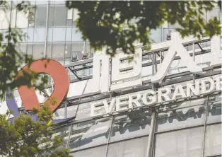  ?? QILAI SHEN/BLOOMBERG ?? Because Evergrande acknowledg­ed the widespread impact that defaults on its loans can have on other firms and industries, the size and scope of the problem may be wider than perceived and it could spill over into global markets, say David Rosenberg and Marius Jongstra.