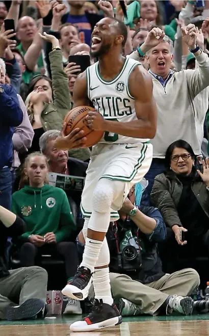  ?? STuART cAHiLL / HeRALd STAFF FiLe ?? SLOW AND STEADY: Celtics guard Kemba Walker celebrates a win over the Knicks at the TD Garden on Nov. 1, 2019.