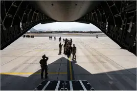  ??  ?? A U.S. Air Force security forces raven, assigned to the 816th Expedition­ary Airlift Squadron, maintains a security cordon outside a U.S. Air Force C-17 Globemaste­r III aircraft in support of Operation Allies Refuge at Hamid Karzai Internatio­nal Airport in Kabul,on Friday. REUTERS
