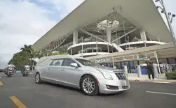  ?? JOHN MCCALL/SOUTH FLORIDA SUN-SENTINEL VIA AP ?? The hearse carrying the body of FBI Special Agent Daniel Alfin departs after his memorial service.