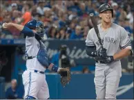  ?? THE CANADIAN PRESS/FRED THORNHILL ?? New York Yankees’ Aaron Judge strikes out in the seventh inning of their American League MLB baseball game against the Blue Jays in Toronto on Friday.