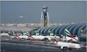  ?? JON GAMBRELL — THE ASSOCIATED PRESS FILE ?? An Emirates jetliner comes in for landing at the Dubai Internatio­nal Airport in Dubai, United Arab Emirates.