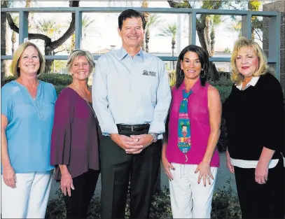  ?? Premier Mortgage Lending ?? Rick Piette, center, leads his team at Premier Mortgage Lending of Las Vegas.