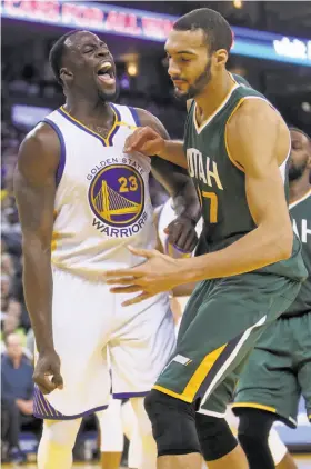  ?? Scott Strazzante / The Chronicle ?? The Warriors’ Draymond Green screams in the direction of Utah center Rudy Gobert during the second quarter of a 104-74 home victory Dec. 20.