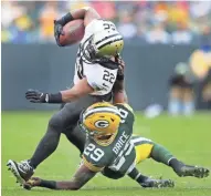  ?? WM. GLASHEEN/USA TODAY NETWORK-WISCONSIN ?? Packers defensive back Kentrell Brice is callled for a horse collar while tackling Saints running back Mark Ingram on Sunday.
