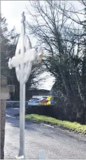  ?? (Pic: KH-d) ?? The scene at Killacluig church on Friday, as a Garda cordon secured access routes to the crime scene.