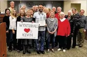  ?? THE CITY OF DUNWOODY ?? The city of Dunwoody honors mail carrier Kevin Addison (center) after he aided police in catching an identify fraud suspect.
